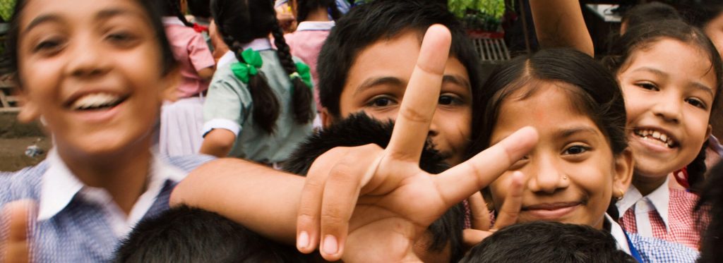Children celebrating support made possible when you donate to local charities